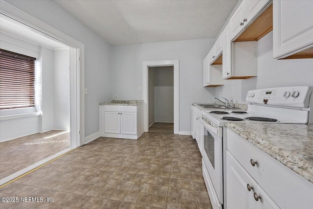 kitchen featuring sink, a textured ceiling, white cabinets, and white range with electric cooktop