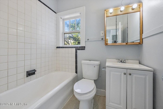 bathroom featuring vanity, a tub, and toilet