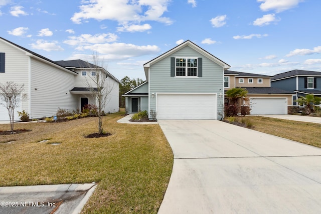 view of front of property featuring a front lawn and a garage