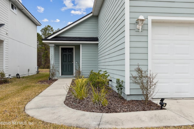 doorway to property featuring a garage