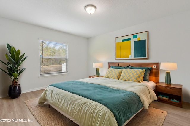 bedroom with light hardwood / wood-style flooring