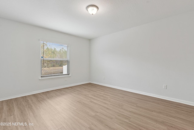 empty room with light hardwood / wood-style floors