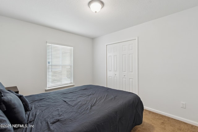 carpeted bedroom with a closet