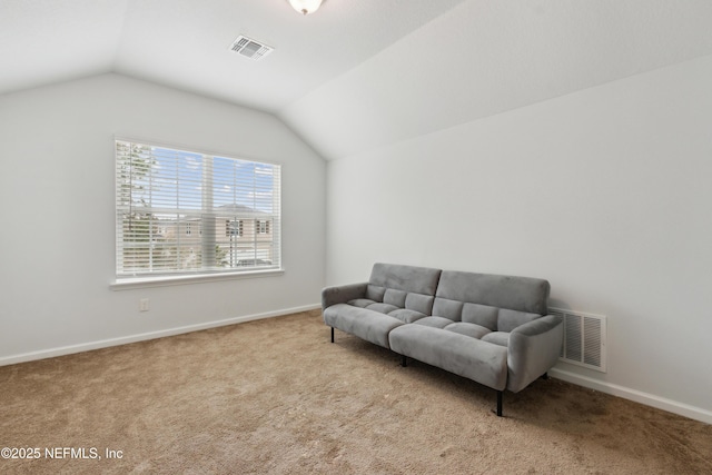 living area featuring lofted ceiling and light carpet