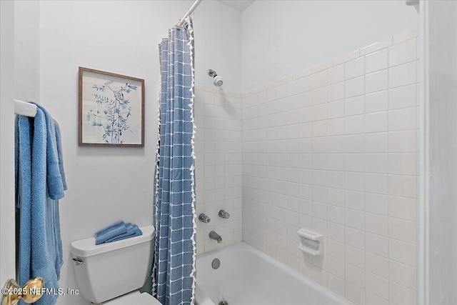 bathroom featuring toilet and shower / bath combination with curtain