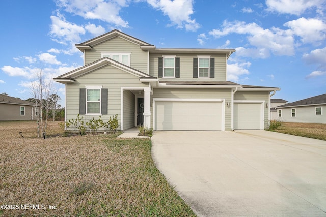 view of front of property featuring a garage and a front lawn