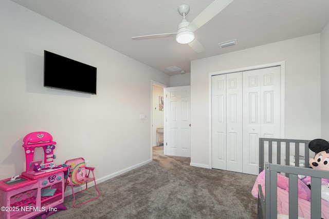 carpeted bedroom featuring a closet and ceiling fan