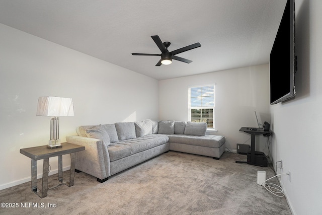 living room featuring ceiling fan and carpet flooring