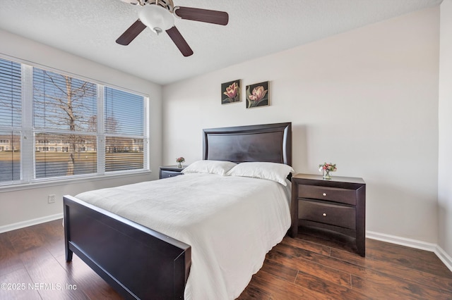 bedroom featuring dark wood-type flooring and ceiling fan