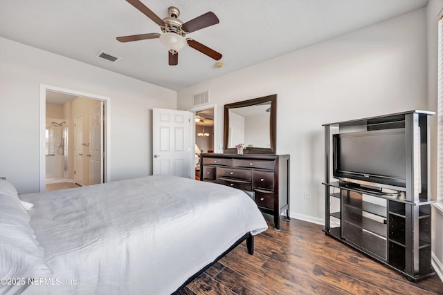 bedroom with dark wood-type flooring, ceiling fan, and ensuite bath