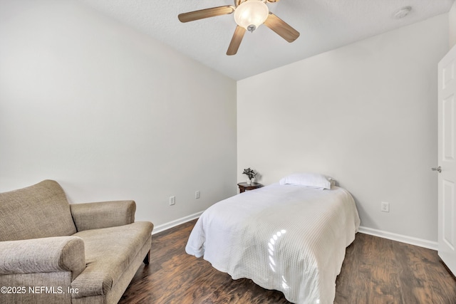 bedroom with dark wood-type flooring and ceiling fan