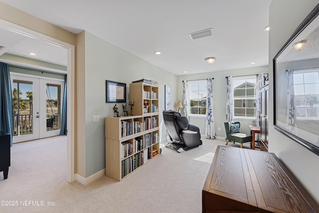 office area featuring light colored carpet and french doors