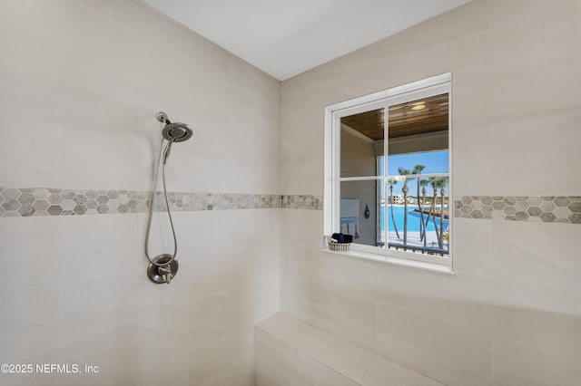 bathroom with tiled shower