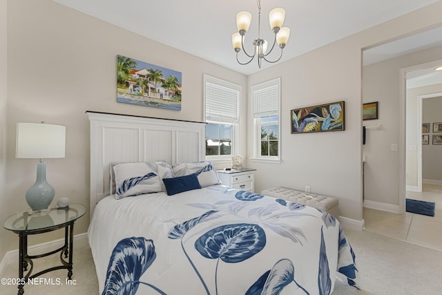 carpeted bedroom featuring a chandelier