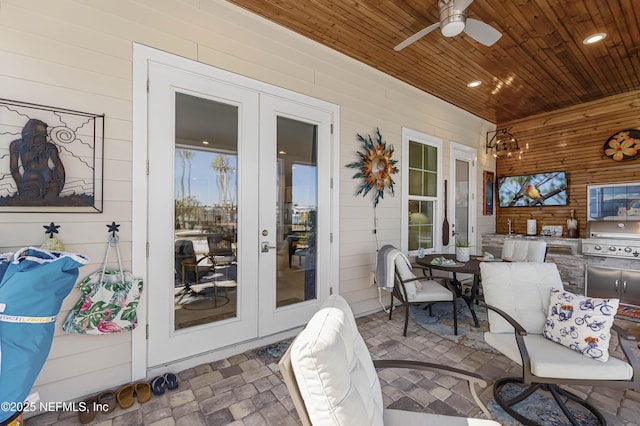 view of patio featuring french doors, ceiling fan, a grill, and area for grilling