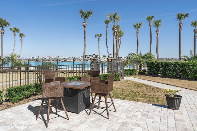 view of patio with a water view