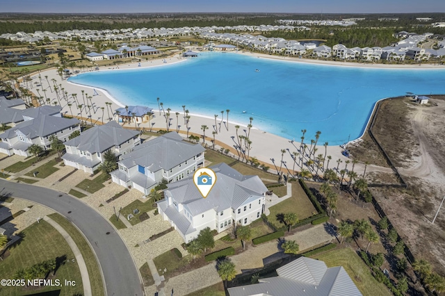 aerial view featuring a beach view and a water view