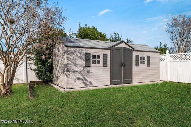 view of outdoor structure with a lawn