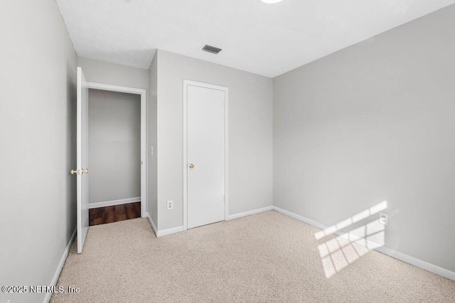 unfurnished bedroom with carpet