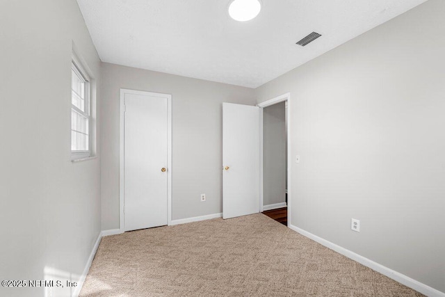 unfurnished bedroom featuring carpet floors