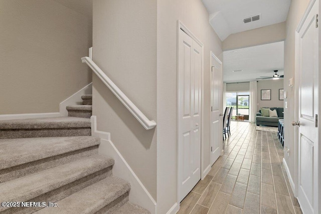 stairway with ceiling fan