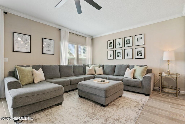 living room with ceiling fan, crown molding, light hardwood / wood-style floors, and a textured ceiling