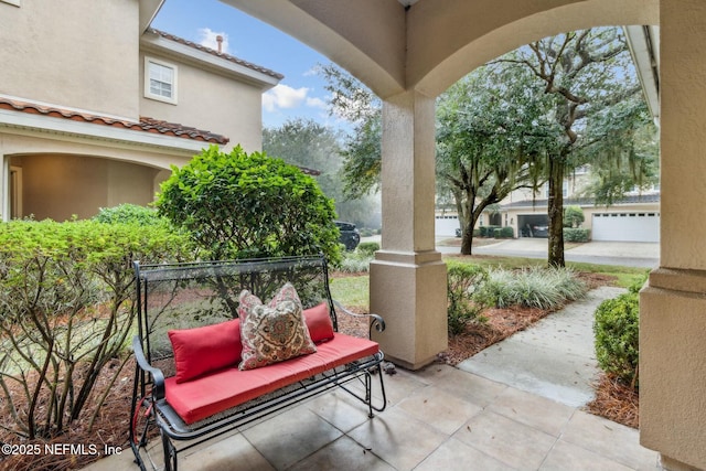 view of patio featuring a garage