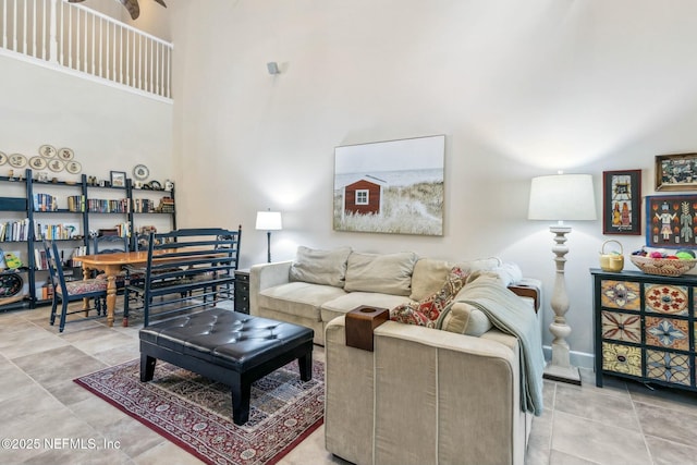 living room featuring a towering ceiling