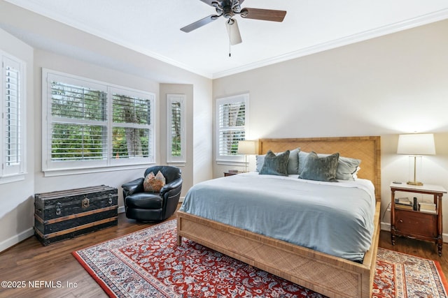 bedroom featuring ornamental molding, ceiling fan, and dark hardwood / wood-style flooring