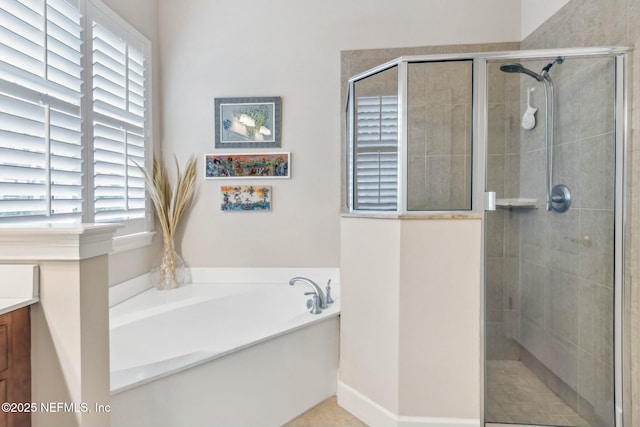 bathroom with vanity, a wealth of natural light, and plus walk in shower