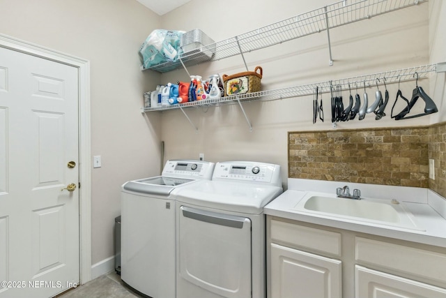 laundry area featuring sink and washer and dryer