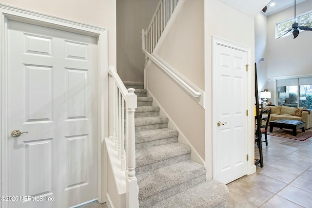 stairs with tile patterned floors