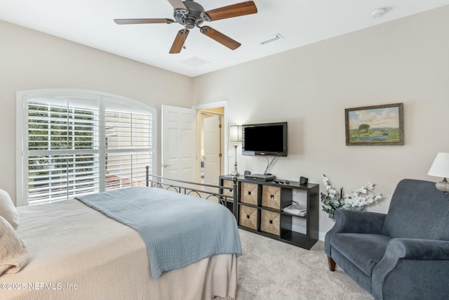 bedroom with light carpet and ceiling fan