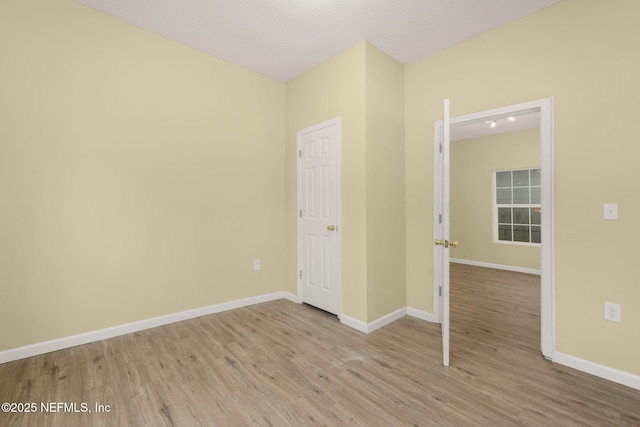 empty room with light wood-type flooring