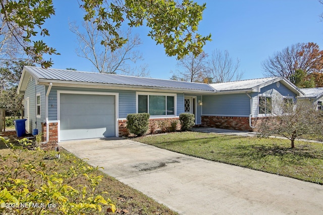 single story home with a garage and a front lawn