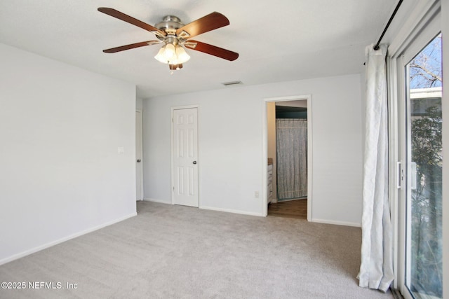 unfurnished room with ceiling fan and light colored carpet