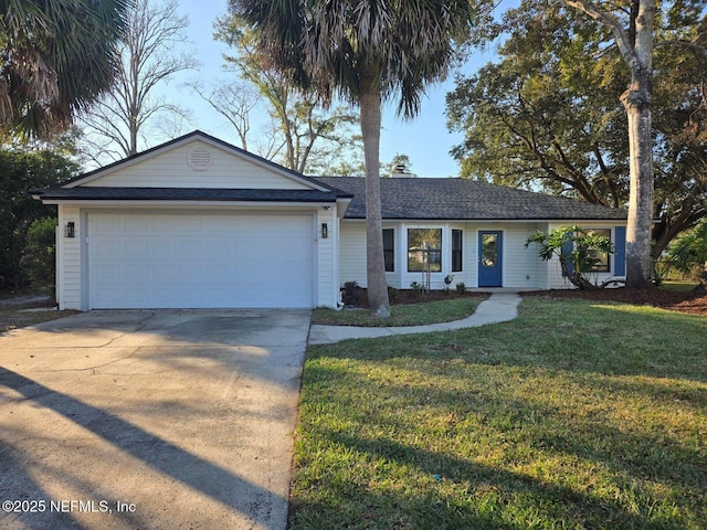 ranch-style home featuring a garage, concrete driveway, a shingled roof, and a front yard