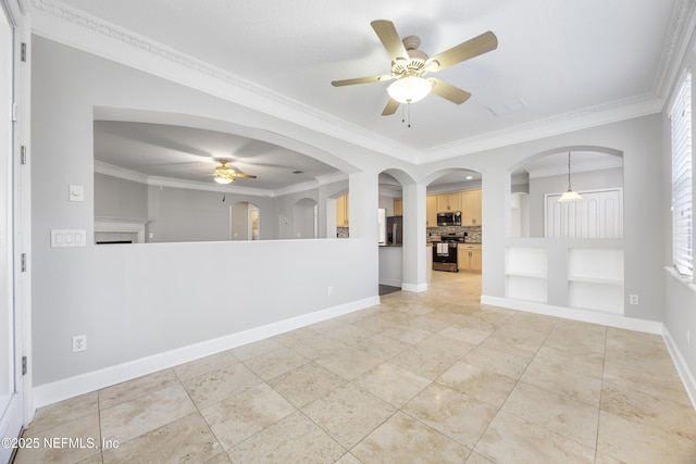 spare room featuring crown molding, light tile patterned floors, and ceiling fan