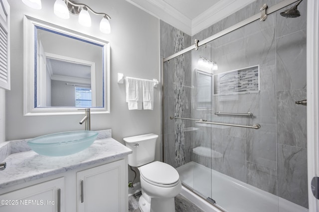 bathroom featuring vanity, an enclosed shower, ornamental molding, and toilet