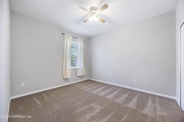 unfurnished room featuring ceiling fan, carpet flooring, and a textured ceiling