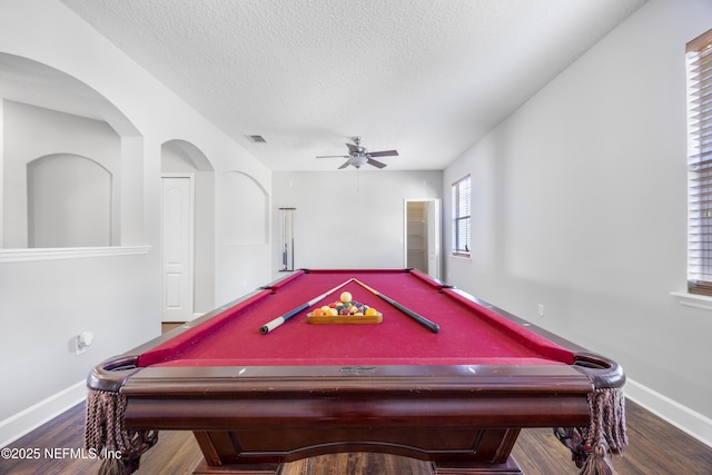 recreation room featuring wood-type flooring, a textured ceiling, and ceiling fan