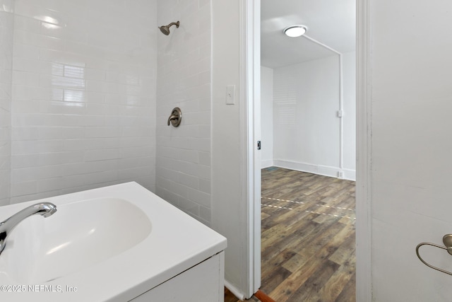 bathroom with sink and hardwood / wood-style floors