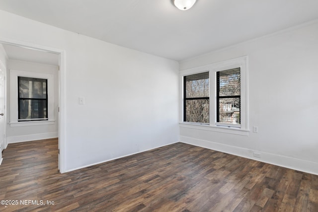 spare room featuring dark hardwood / wood-style flooring