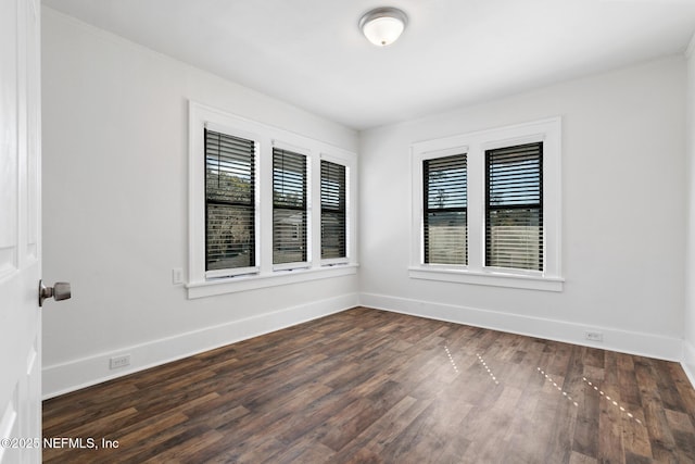 unfurnished room featuring dark hardwood / wood-style floors