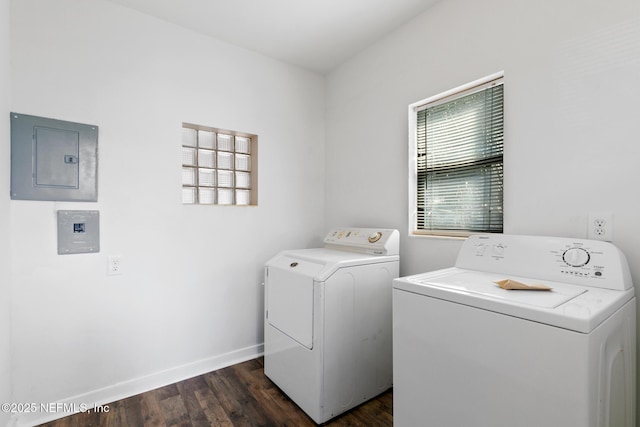 washroom featuring dark hardwood / wood-style floors, electric panel, and washer and dryer