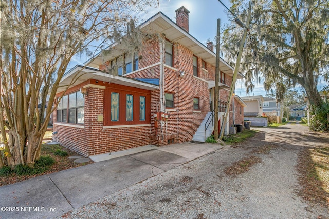 view of side of property with central AC unit