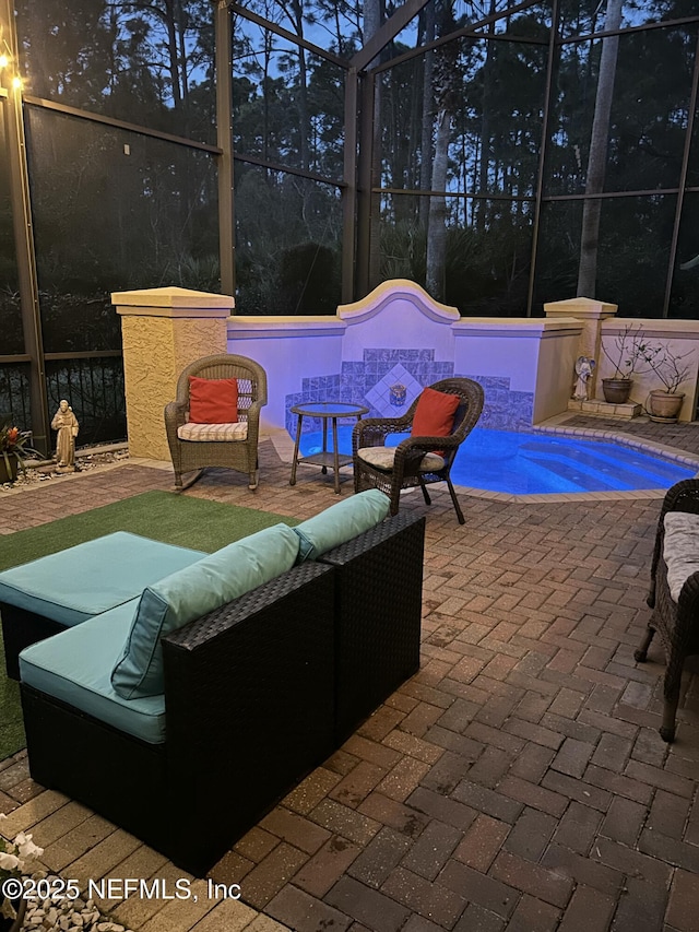 view of patio / terrace with an outdoor hangout area, glass enclosure, and an outdoor pool