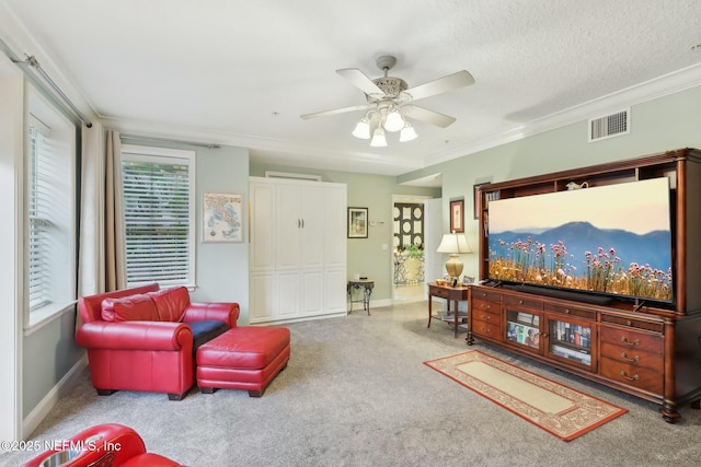 living room with carpet flooring, crown molding, and baseboards