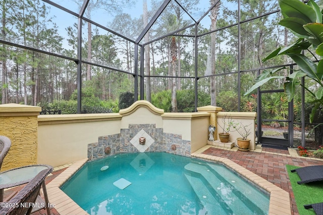 view of pool with a lanai