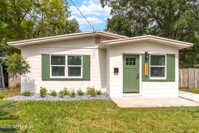 view of front of home with a front yard